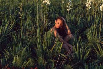 Summer sunny evening with a young woman