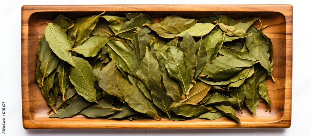 Sticker Top down view of a tray filled with a stack of dry laurel leaves perfect for adding flavor to your culinary creations Ample space for customization or presentation