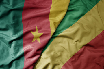 big waving national colorful flag of cameroon and national flag of republic of the congo .