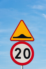 Traffic signal speed limited to 20km. traffic signs. Limit of velocity and speed bump