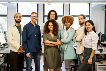 Portrait of the multicultural group of coworkers standing in the office