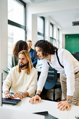 Men using computer in a coworking hub