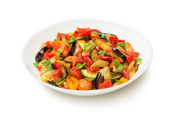 Sautéed  eggplant zucchini carrots and tomatoes in a salad bowl isolated on white background. - 671844380