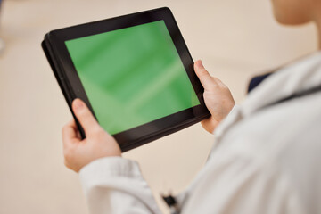 Hands, healthcare and green screen on a tablet with a doctor in the hospital for review or diagnosis. Medical, website or research with blank chromakey space on an empty display or screen in a clinic