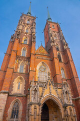 Cathedral of St. John the Baptist church with two spires in old historical city centre, Ostrow...