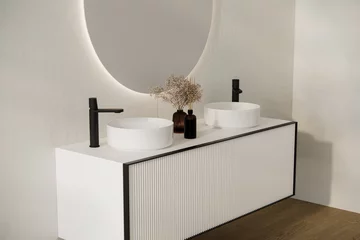 Poster Close up of comfortable double sink with two round mirrors standing on wooden countertop in modern bathroom with white walls. © leymandesign