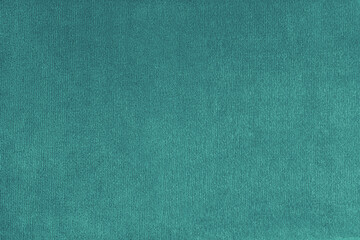 Texture background of velours turquoise fabric. Upholstery texture fabric, velvet furniture textile...