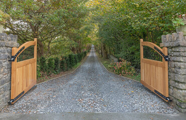 Open gates looking down a driveway