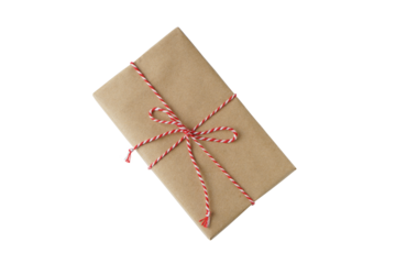Christmas and New Year gift box wrapped in brown craft kraft paper with red and white baker's twine, ribbon bow isolated on white, transparent background, PNG