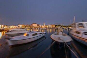 Picture over the harbor of Fazana in Istria in the evening during sunset