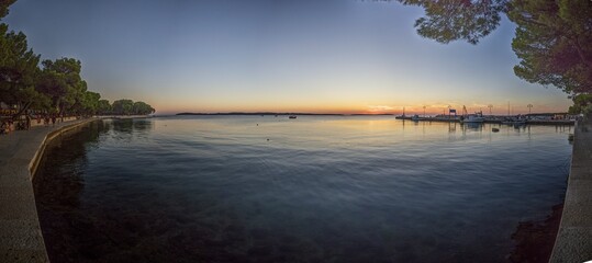 Picture over the harbor of Fazana in Istria in the evening during sunset