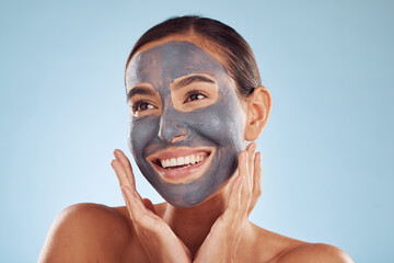 Woman thinking, mask and facial charcoal for skincare, natural beauty and cosmetics benefits on studio, blue background. Ideas of happy person or model with face collagen, skin care and dermatology