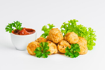 Breaded chicken nuggets.Breaded Chicken Inner Fillet with green lettuce leaves on a White Background.Chicken Breaded Raw Meat,Fillet.Fast homemade food at home. Chicken breaded schnitzels.Fast cooking