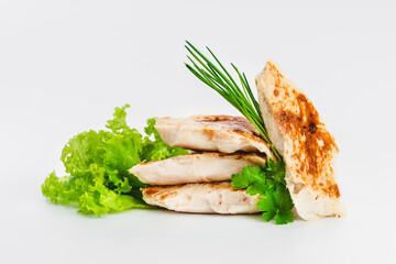 Chicken fillets fried until half cooked, semi-finished product with fresh herbs on a white background. Fast cooking.Fast homemade food.Fast food. Quick cooking at home. Copy space.