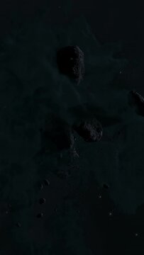 Asteroid belt field in dark outer space. 3D animation wide pan shot. Rock formations of cosmic debris and giant Meteorites. Celestial objects on starry stars background with dust nebula haze low light