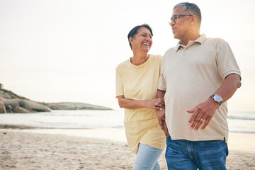 Smile, walking and senior couple at the beach happy, relax and bond in nature together. Love,...