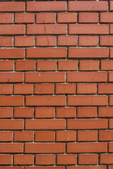 Fototapeta premium red brick wall in old european city as background