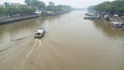 Banjarmasin's Siring river area which is filled with rental engine boats used for Banjarmasin river tourism
