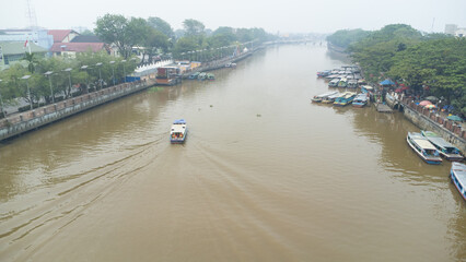 Banjarmasin's Siring river area which is filled with rental engine boats used for Banjarmasin river tourism