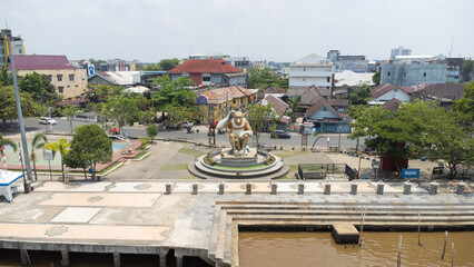 Aerial view of the monkey statue as a typical monument in Banjarmasin in the morning when the...
