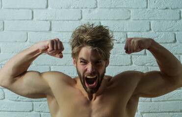 Strong Muscular guy. Power man body. Muscles body. Angry man. Aggressive expression. Screaming,...