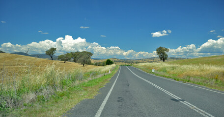 Travelling in the Hilltop region of NSW Australian travel, with clouds and blue skies.