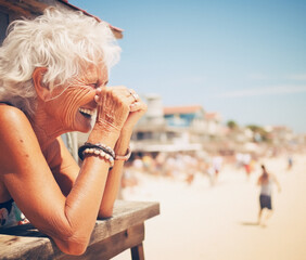 Happy Senior Caucasian Woman Leaning On Wooden Railing At Beach; AI Generated - 671914935