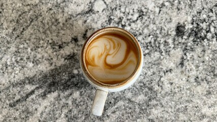 cup of coffee on a white granite background