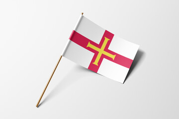 Guernsey flag of small paper, isolated on white background