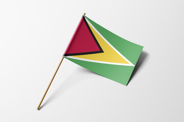Guyana flag of small paper, isolated on white background