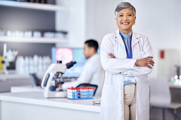 Portrait, research and senior woman with arms crossed, medical and scientist with lab equipment, smile and growth. Female person, confidence and healthcare professional with science and innovation