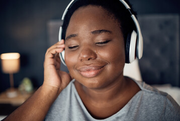 Crying, happy and black woman with headphones for music, sound or audio. Tears, radio and plus size...