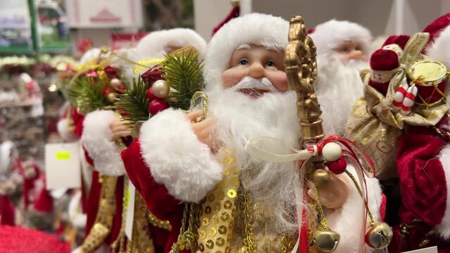 New Santa Claus figurines are on sale in a store before Christmas