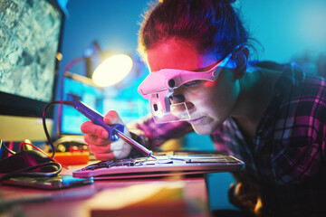Woman, computer motherboard and soldering iron for manufacturing, microchip and it development. Information technology, circuit board and electronics for engineering, hardware and system with tools
