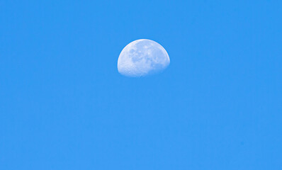 Moon in the blue sky, natural background, closeup of photo