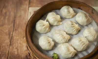 Dumplings in a wooden steamer