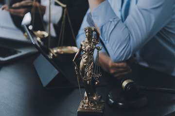 Business and lawyers discussing contract papers with brass scale on desk in office. Law, legal...