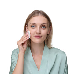 Young woman cleaning her face with cotton pad on white background