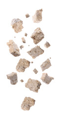 Pieces of tasty halva falling on white background