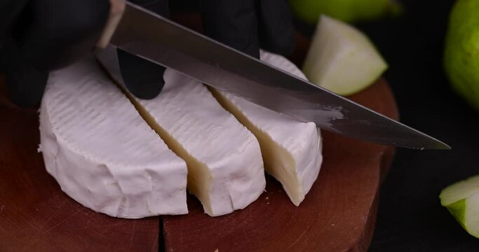 cut soft fresh hard cheese with white mold, delicious cheese covered with white edible mold