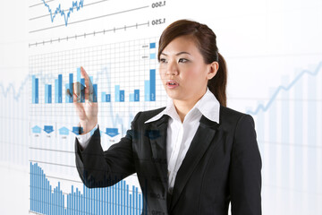 businesswoman looking at a finance chart