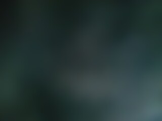 Abstract blurred background image of black color gradient used as an illustration. Designing posters or advertisements.