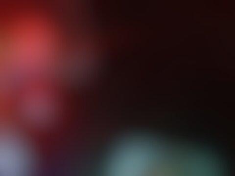 Abstract blurred background image of red color gradient used as an illustration. Designing posters or advertisements.