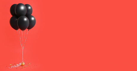 Balloons on red background with space for text. Black Friday sale