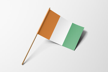 Ivory Coast flag of small paper, isolated on white background