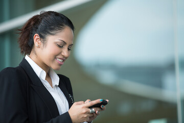 Fototapeta premium Indian business woman using mobile phone.