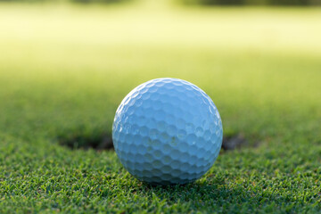 A golf ball and hole