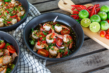Fresh shrimp on a plate and fresh vegetables, cooked shrimp prawns and seafood spicy chili sauce coriander, cooked shrimp salad lemon-lime