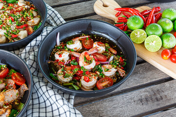 Fresh shrimp on a plate and fresh vegetables, cooked shrimp prawns and seafood spicy chili sauce coriander, cooked shrimp salad lemon-lime