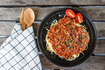 Traditional italian spaghetti bolognese on a plate. Bolognese sauce is classic italian cuisine dish. Popular italian food.